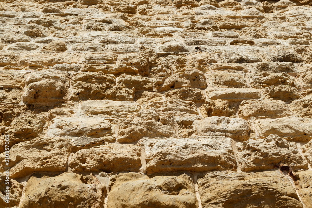 weathered Limestone texture background, blocks make the huge stone walls of the castle of Fort weathered Limestone texture background, blocks make the huge stone walls of the castle of Fort