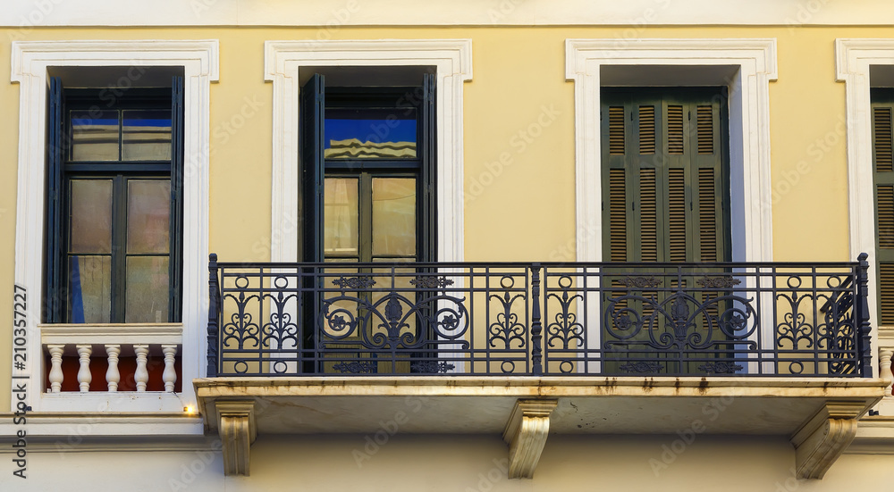 The Renovated Facade of the Old Italian House with Balcony, Crete, Greece
