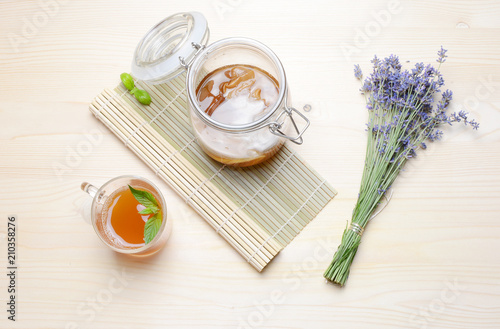 Fresh home made Kombucha fermented tea on a wooden background. photo