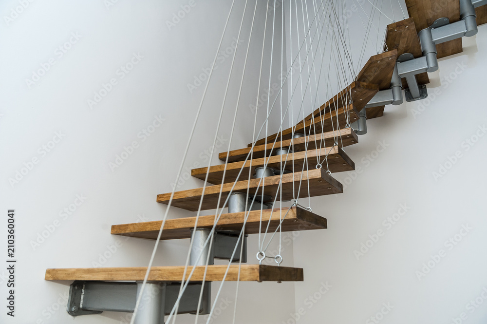 Hanging stairs/Interior design house apartment staircase made of steel and  wood apparently floating. Stock Photo | Adobe Stock