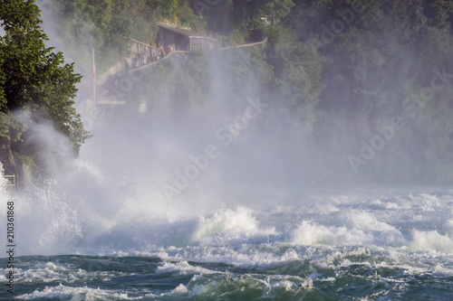 View of a powerful waterfall on the River Rhine in Switzerland, the beauty of Europe.