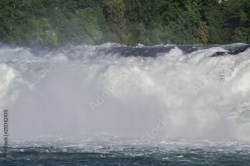 View of a powerful waterfall on the River Rhine in Switzerland  the beauty of Europe.