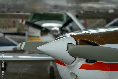 Small Sport Aircraft parked in hangar, close up. detail