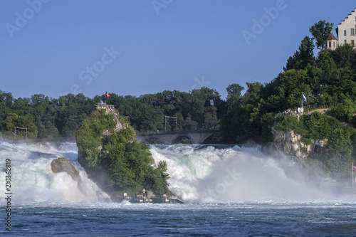 View of a powerful waterfall on the River Rhine in Switzerland, the beauty of Europe.