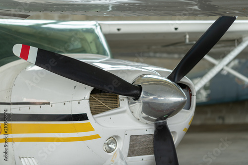 Small Sport Aircraft parked in hangar, close up. detail