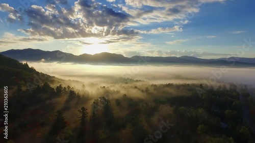 Sunrise aerial of the Adirondack mountains with dramatic low dense fog photo