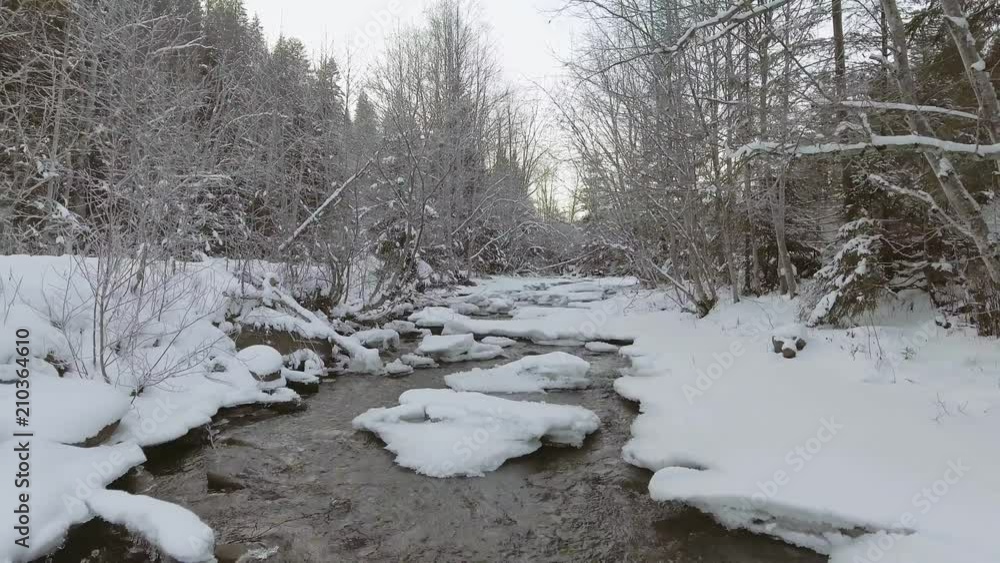 AERIAL: Flight over the river in winter AERIAL: Flight over the river in winter