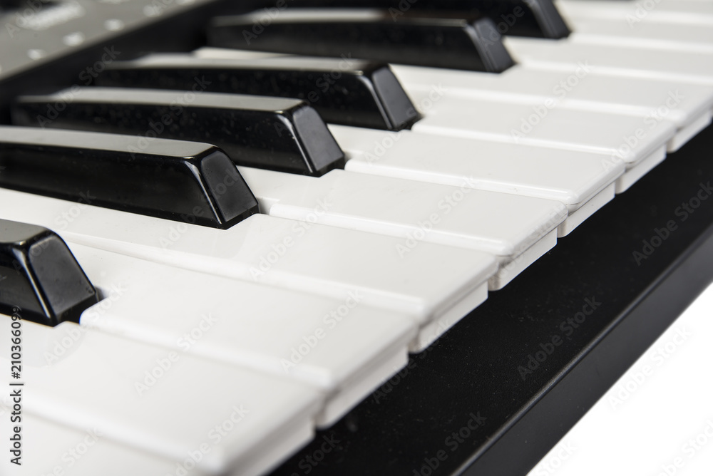 Piano keyboard instrument closeup. Home synthesizer Piano keyboard instrument closeup. Home synthesizer