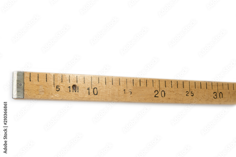 Wooden used stick meter on the white background Wooden used stick meter on the white background