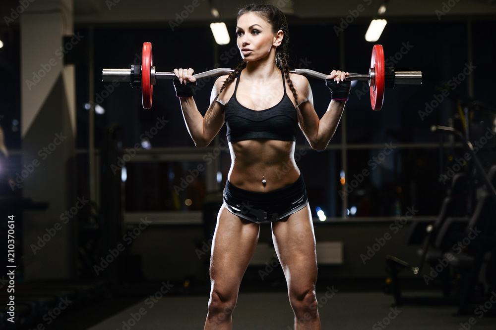 brunette sexy athletic young girl working out in gym brunette sexy athletic young girl working out in gym