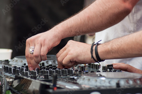 closeup of hands of mixer at dance floor in outdoor