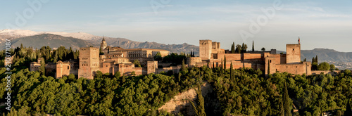 Panoramic view of Alhambra in Granada with Sierra Nevada. Palacios Nazaríes, Palace of Charles V, Alcazaba. Andalusia, Spain