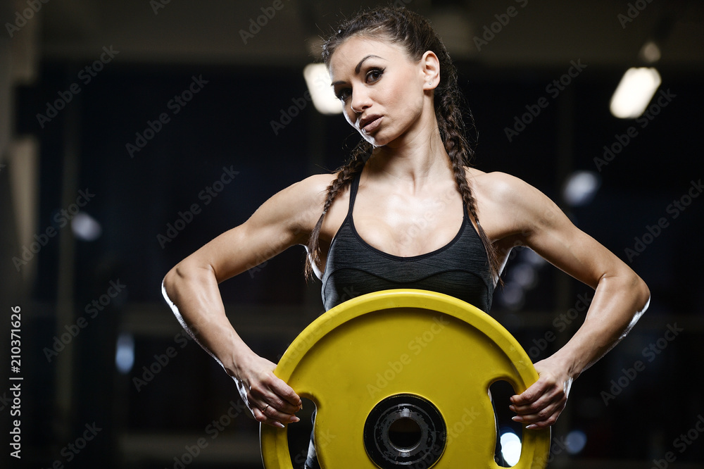 brunette sexy athletic young girl working out in gym brunette sexy athletic young girl working out in gym