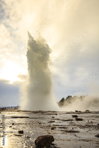 Geyser fountain discharges water at Strokkur Geysir, Iceland located at the golden circle route