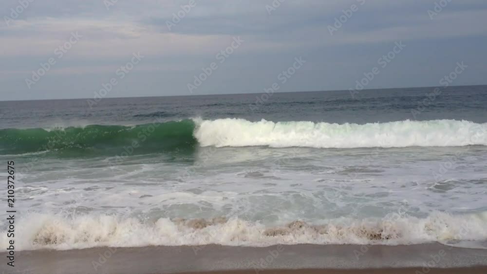 Waves crashing on a New England beach in Cape Cod Waves crashing on a New England beach in Cape Cod