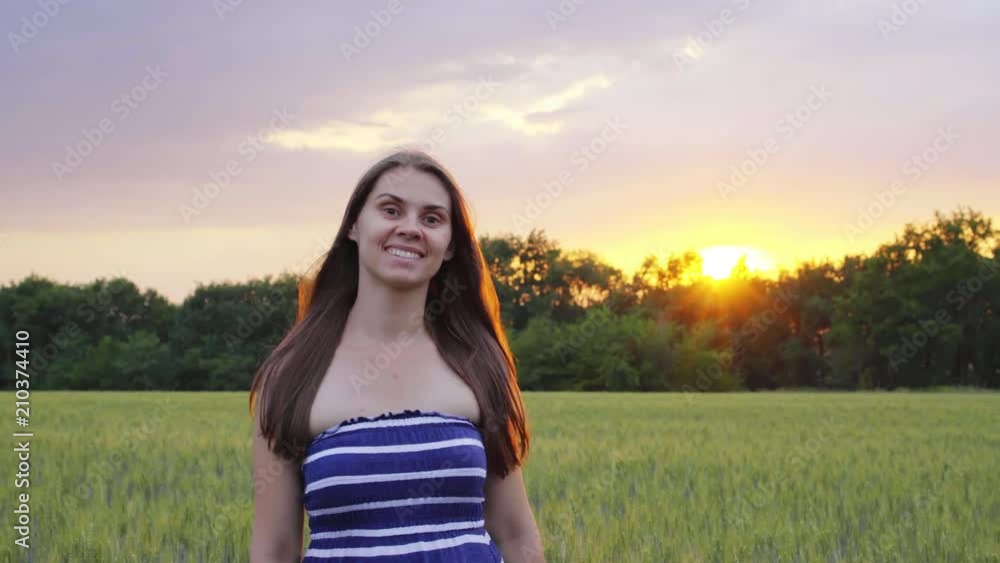 girl going cross the wheat field at sunset. girl going cross the wheat field at sunset.