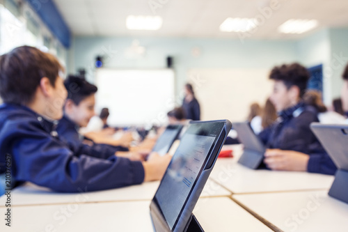 children study in class with their tablet