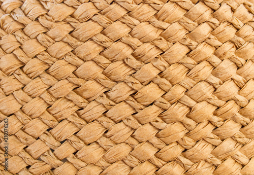 The texture of the weave of straw. Seamless background for design