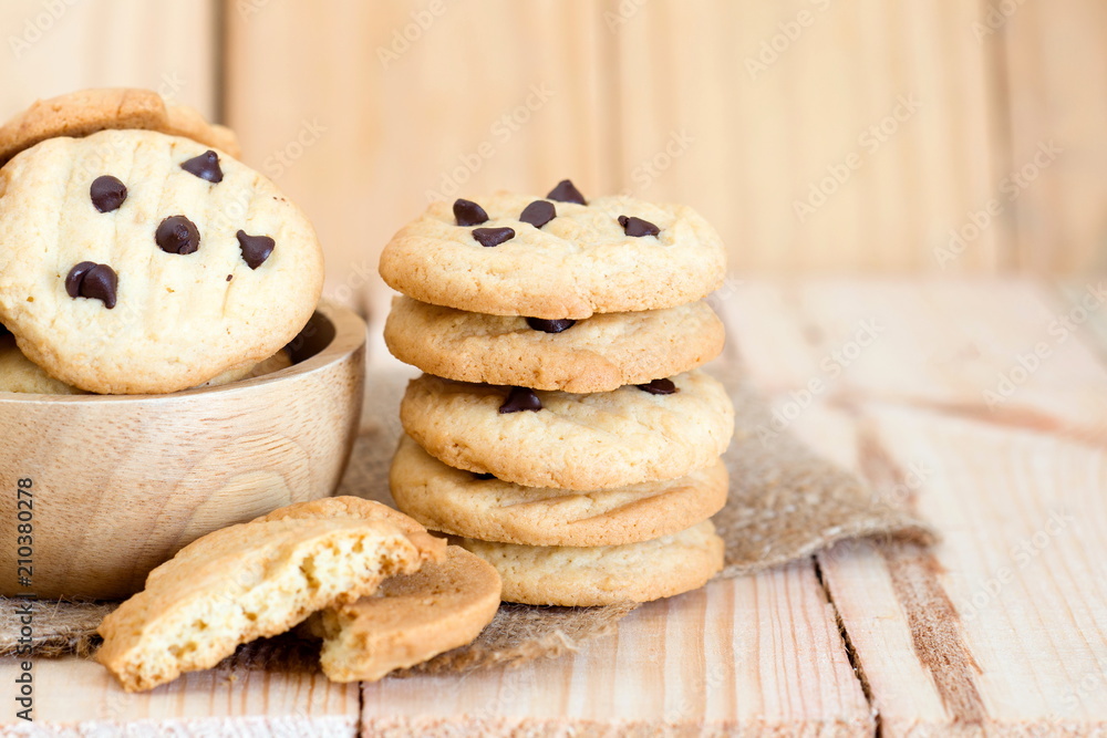 Pile of Chocolate chip cookies on wooden table. Pile of Chocolate chip cookies on wooden table.