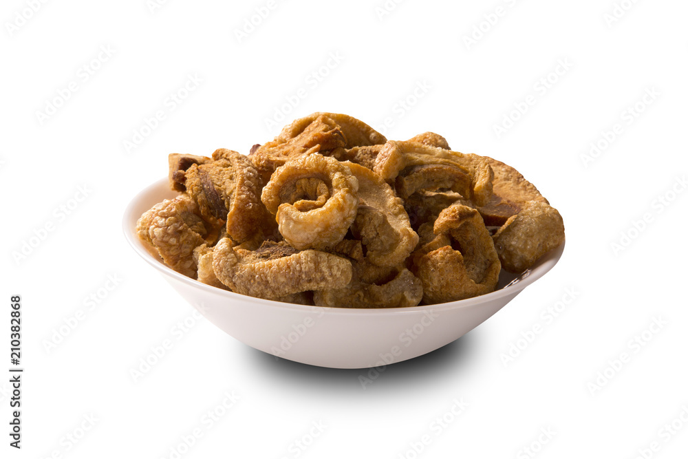 Pile of fried bacon cube portion in a white plate isolated.