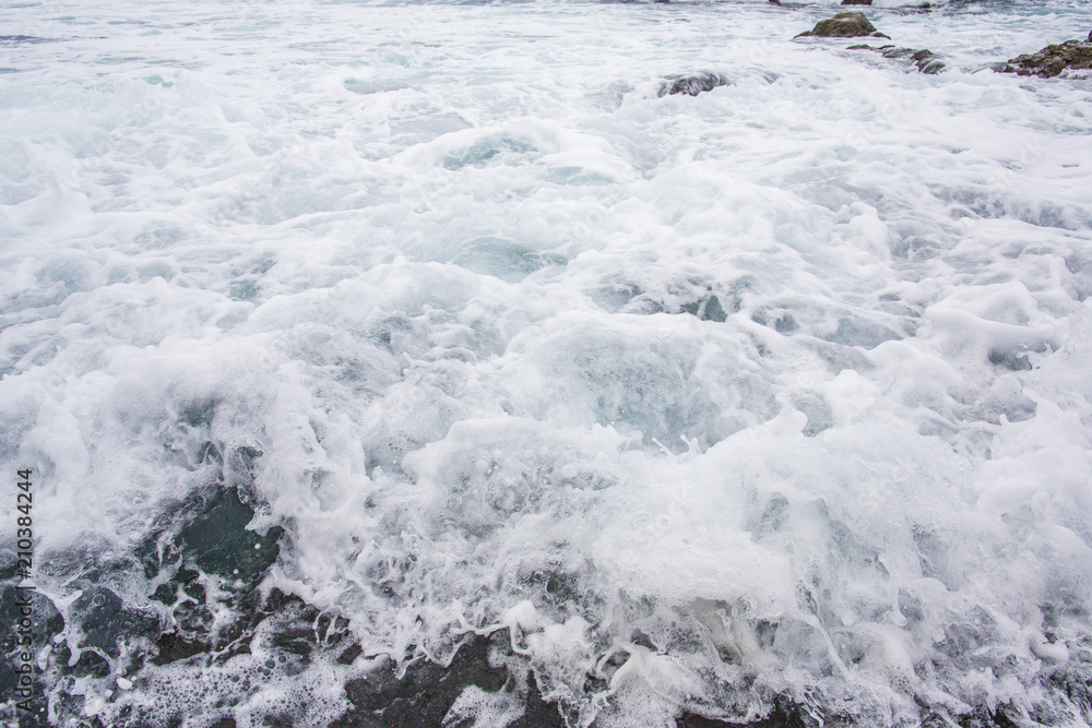 Ocean wavy surface close up. sae water texture background, motion blur. .Tenerife, Puerto De La Cruz.