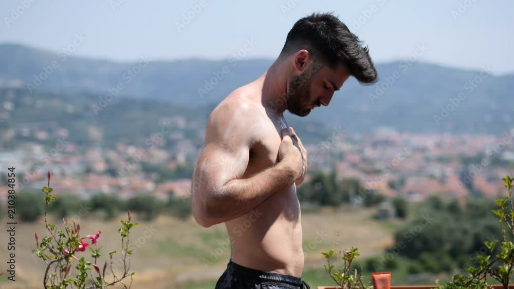 Shirtless Young Man Putting on Sunscreen Cream, Muscular Man Wearing ...