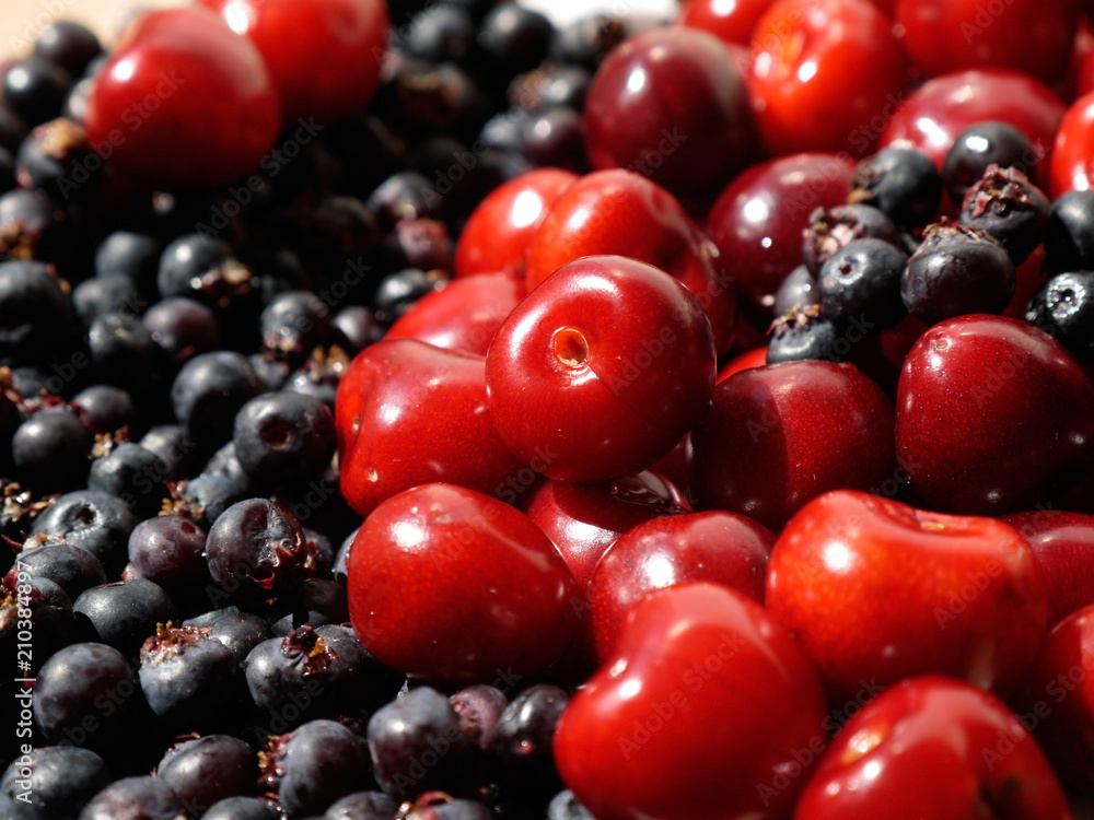 red cherries and black berries