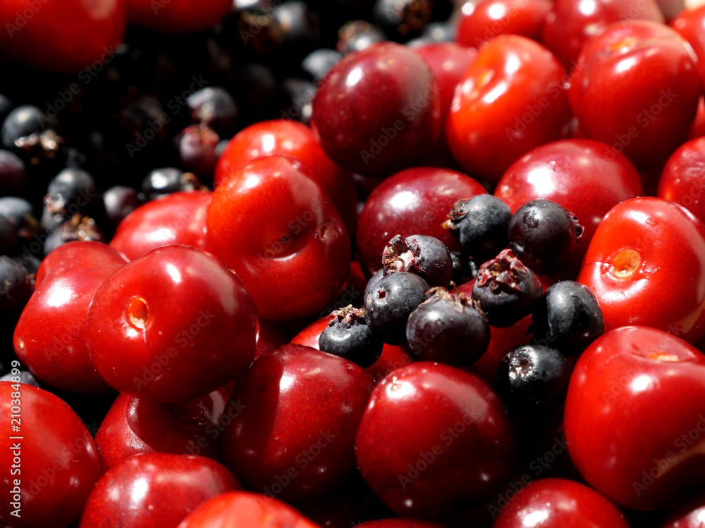 red cherries and black berries red cherries and black berries