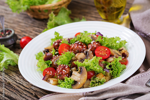 Salad with meatballs, eggplant, mushrooms and tomatoes in Asian style. Healthy food. Diet meal.