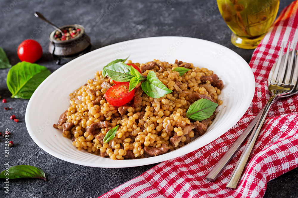 Israeli couscous with beef. Tasty food. Asian meal. Israeli couscous with beef. Tasty food. Asian meal.
