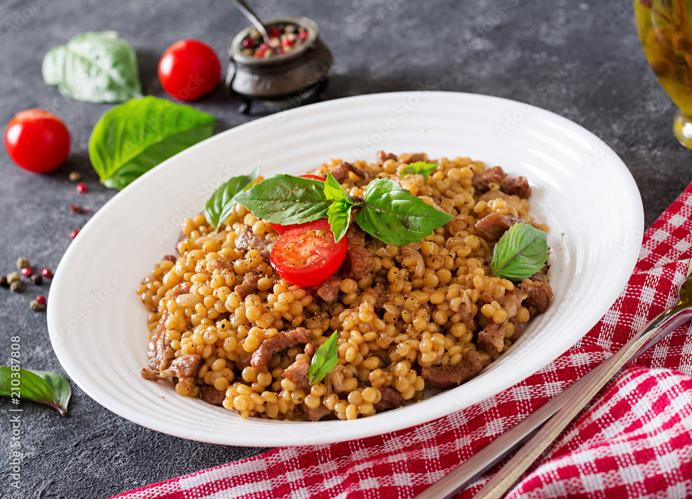 Israeli couscous with beef. Tasty food. Asian meal. Israeli couscous with beef. Tasty food. Asian meal.