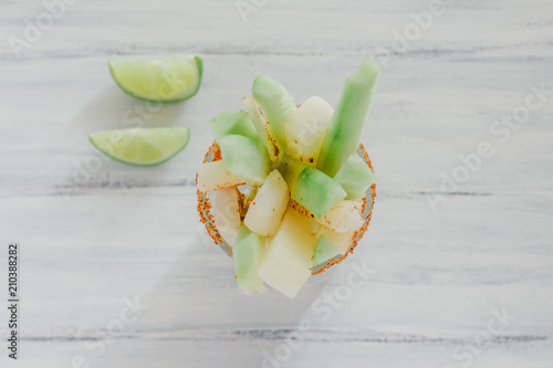 pepinos y jicama con chile, mexican snack, cucumber and jicamas with chili, spicy food in mexico photo