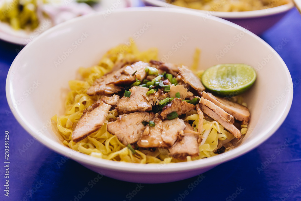 Egg noodle with sliced barbeque pork served with lime. Egg noodle with sliced barbeque pork served with lime.