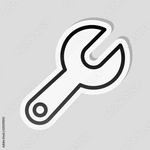 Simple wrench. Linear, thin outline. Sticker style with white bo