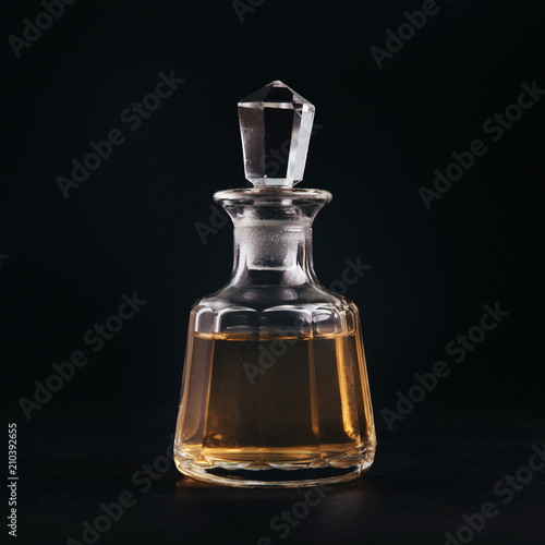 Purfume bottle on black background