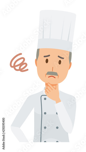 An elderly male chef wearing a cook coat is in trouble