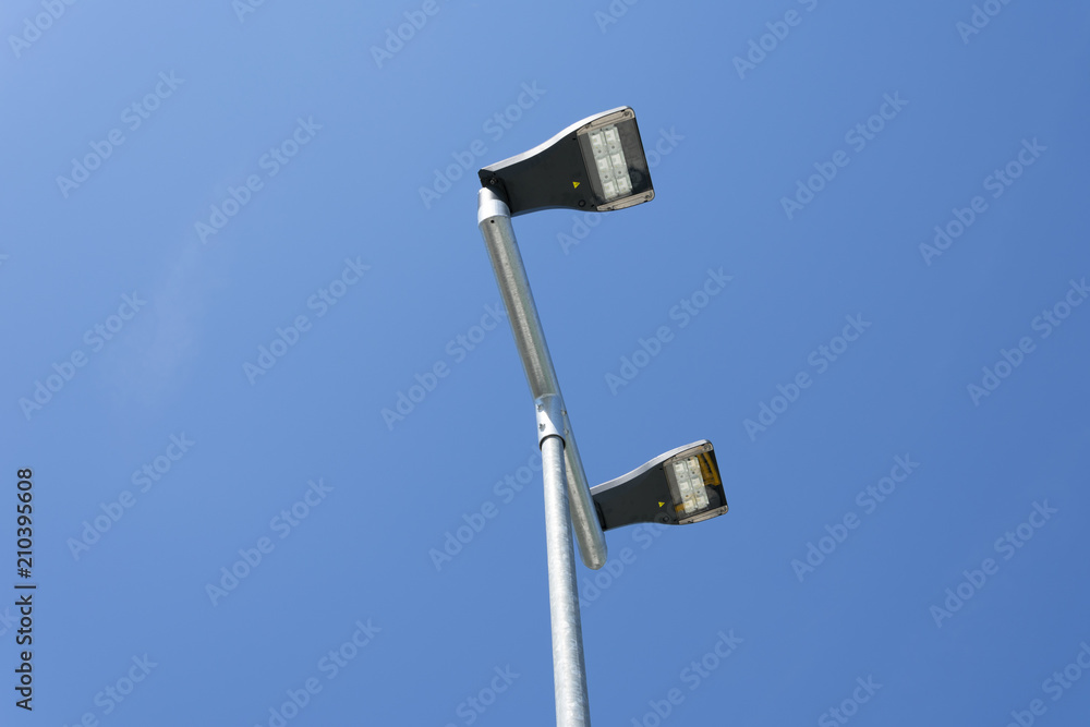 Double Street lamp as a background a bright blue sky Double Street lamp as a background a bright blue sky