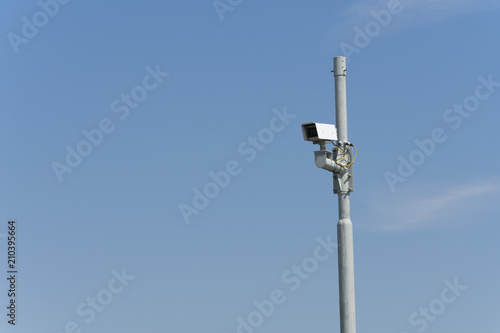 security camera high fastened to a pole