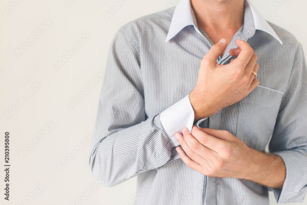 Elegant young fashion man fixing cufflinks(close up) Elegant young fashion man fixing cufflinks(close up)