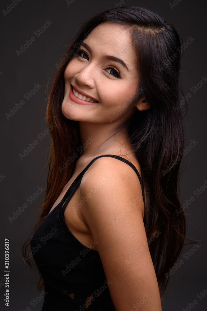Young beautiful Asian woman smiling Young beautiful Asian woman smiling