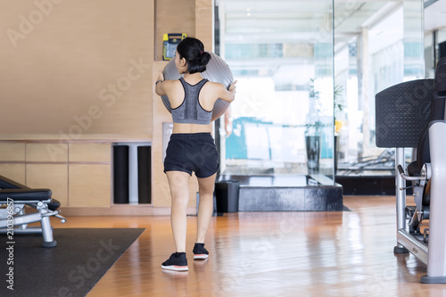 Young woman exercising with a yoga ball