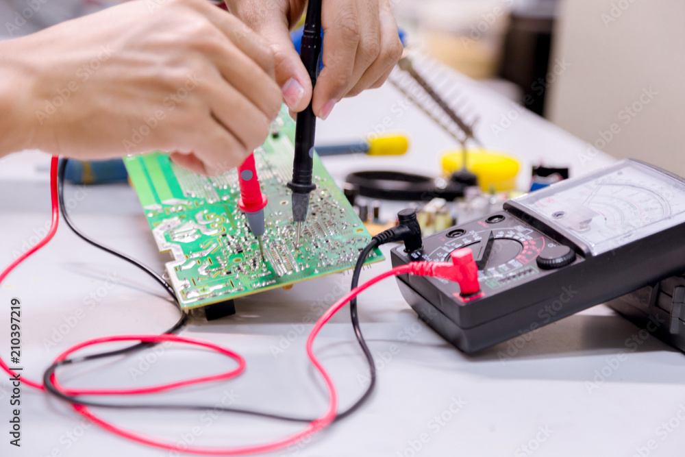 Close up of the hand men hold tool repairs electronics manufacturing Services,Repair of electronic devices, tin soldering parts.