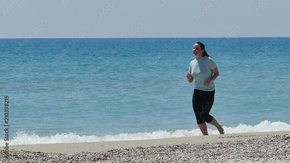 woman runs the beach beautifully woman runs the beach beautifully