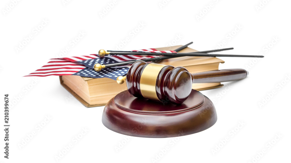 Judge's gavel with american flag and book on white. American law.