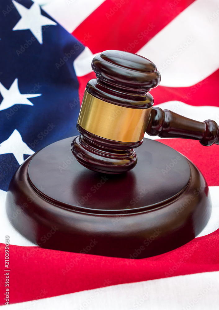 Judge's gavel on american flag. American law.