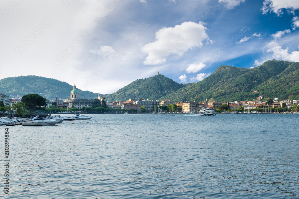 Como lake, Como city, northern Italy. View of Como city on a beautiful summer morning with a departing hydrofoil