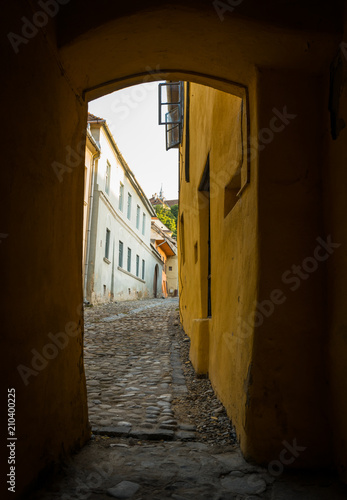 Narrow alley in a medieval city in Europe. Romanian city of Sighisoara