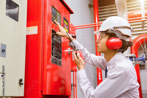 Engineer checking Industrial fire control system,Fire Alarm controller, Fire notifier, Anti fire.System ready In the event of a fire. photo