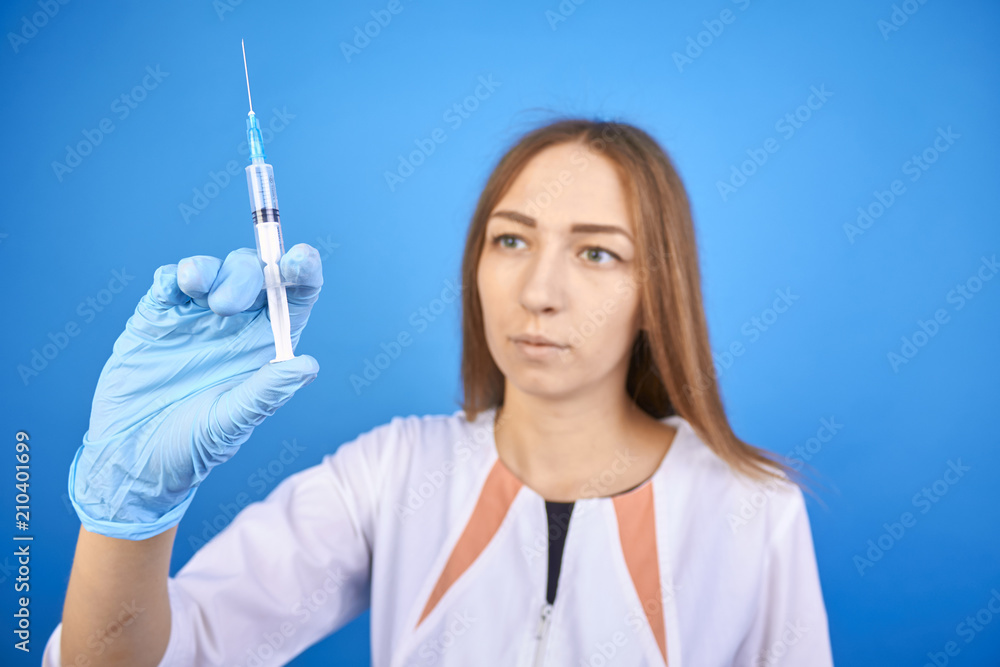 syringe in the hand of a nurse syringe in the hand of a nurse