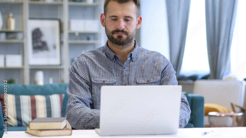 Man Leaving Workplace after Completing Work on Laptop Man Leaving Workplace after Completing Work on Laptop